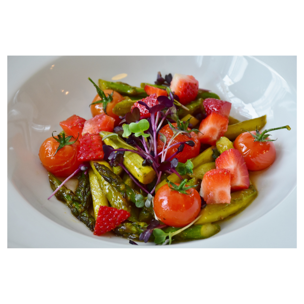 Mixed greens salad with strawberries, tomatoes, asparagus, etc