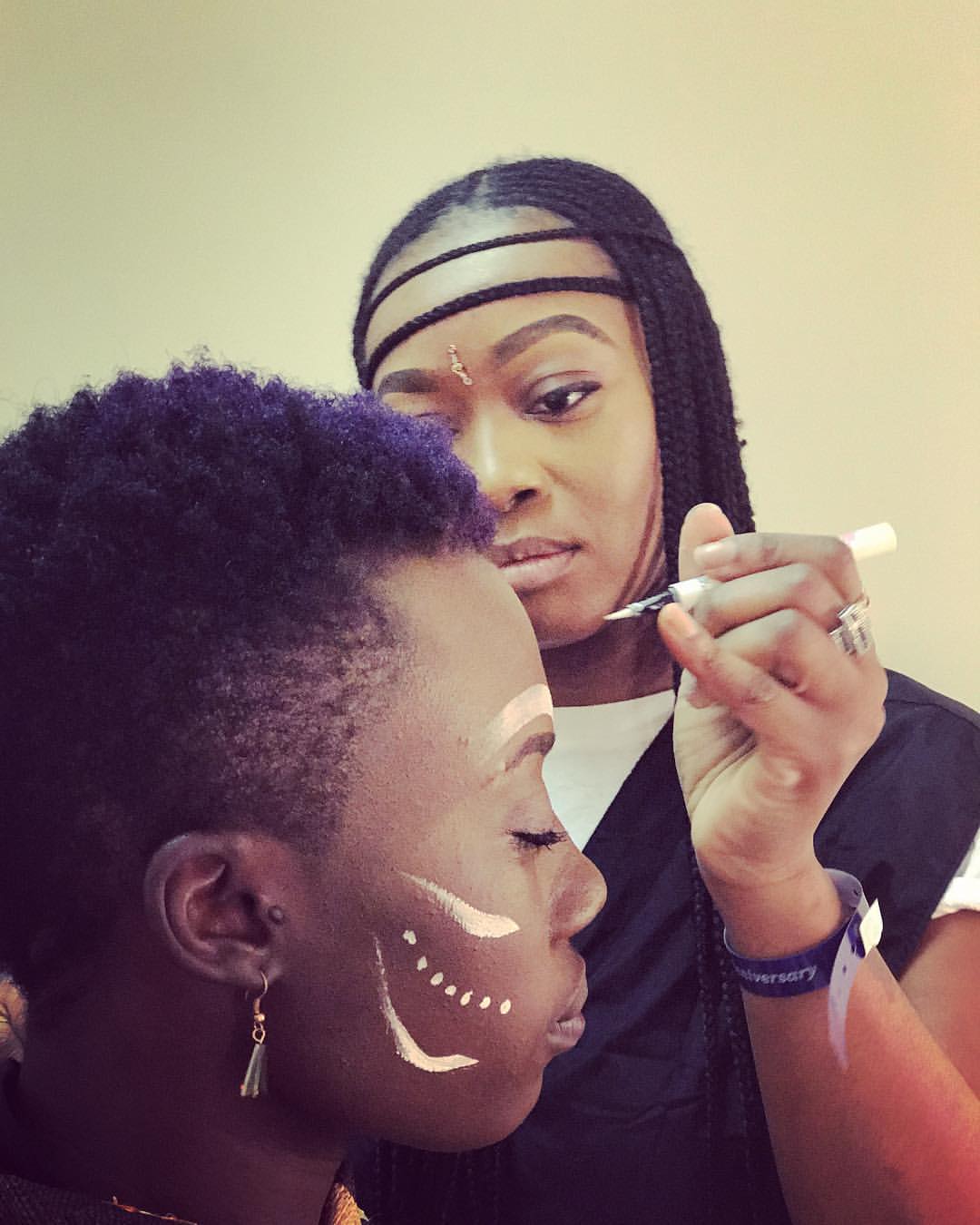 Model Kesha Black getting makeup done for Orcabessa